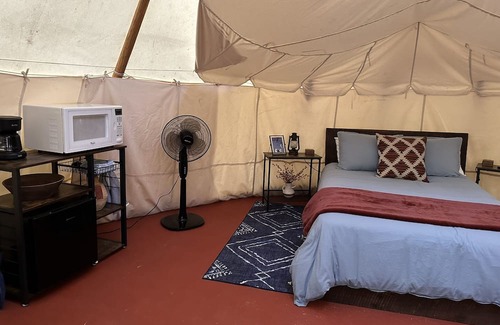 Steelville RV Rental | A teepee on 1200-acre ranch where secluded woods envelope the grounds.