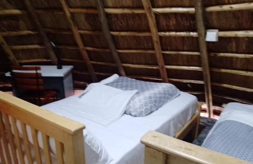 Western Region Other | White Cat Farm Hut Inn is nestled on the outskirts of a quaint African village