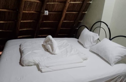 Western Region Other | White Cat Farm Hut Inn is nestled on the outskirts of a quaint African village