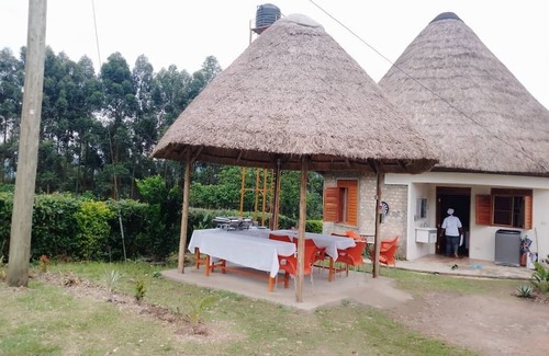 Western Region Other | White Cat Farm Hut Inn is nestled on the outskirts of a quaint African village