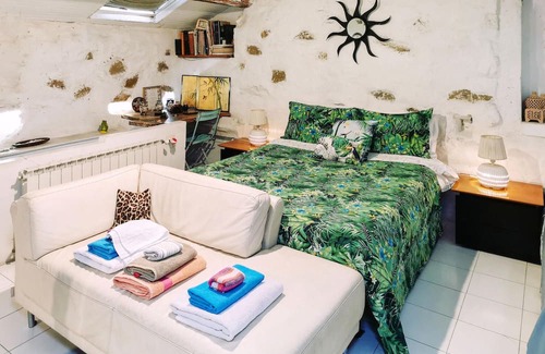 Latte Apartment | With a fantastic view of the sea and the coast, this cozy vacation apartment welcomes you to a green