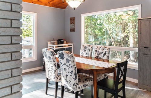 Minden Hills Cottage | Cedar and Sand Lakehouse on Lake Kashagawigamog | Fireplace | Firetable | Dock