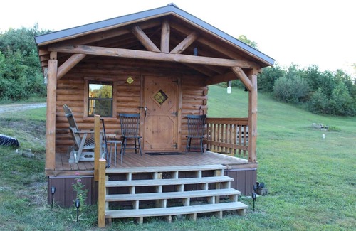 Kerr Apartment | Charming one-room cabin retreat with private bath, kitchenette and log gazebo.