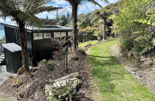 Moetapu Bay Cabin | A cosy two bedroom off-grid cabin, the perfect place to rest, relax & recharge.