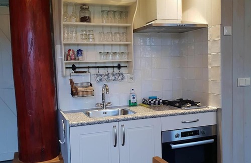 Oudeslius House | Have a unique experience in the Boerderijkamer with private outdoor hot tub , breathtaking views and comfortable amenities. Enjoy a carefree stay with fresh rolls and delicious coffee every day and explore the surrounding area, the beach, Callantsoog