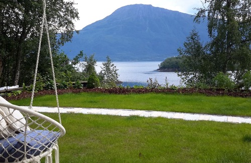 Glomset Apartment | Peaceful countryside flat near Ålesund. Fjord & Mountain views, patio & garden