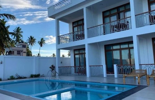 Pwani Mchangani Villa | Villa Blue FishnIt's is Beach Front Villa with Swimming Pool suitable for famil