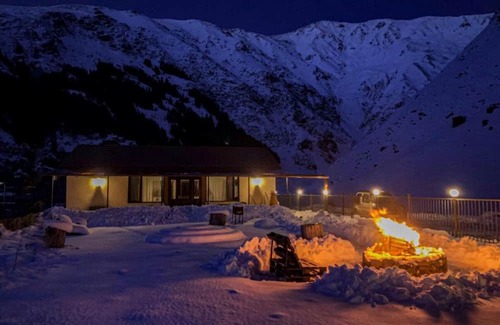Kazbegi House | A Private Guest House in a secluded area by the river, surrounded by mountains.