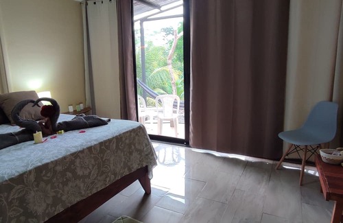 Las Lomas Bed & Breakfast | Kocorica Private room with terrace and bathroom in the countryside.