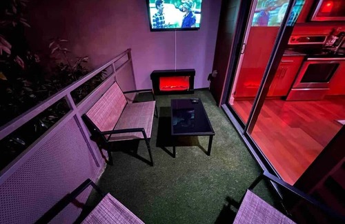 Loring Heights Apartment | The Red Room - Cloud Ceilings - Patio & Bathroom TV