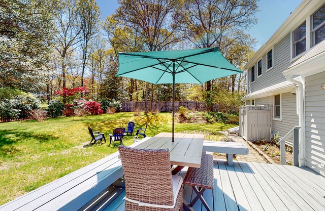 2-story home with outdoor shower, deck, firepit, grill, enclosed yard, & W/D