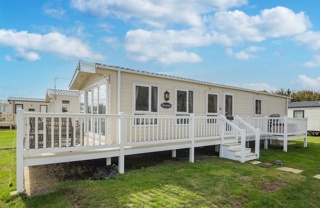 Caravan with decking at Broadland Sands in Suffolk ref 20294BS
