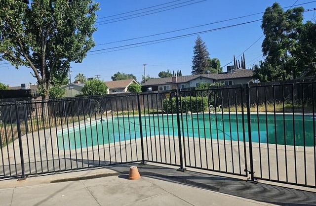 Charming 4 bedroom house with AC and WiFi in quaint Visalia with a gated pool