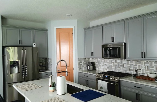 Family home in Beachwalk with roomy common areas and private spaces for a group.