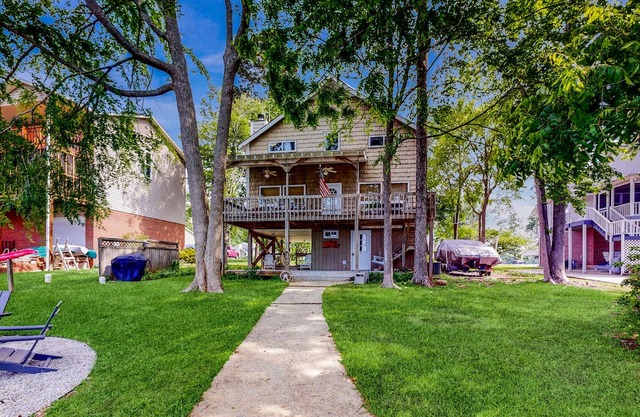 Unique waterfront home with direct water access, dock, firepit, porch, W/D, AC