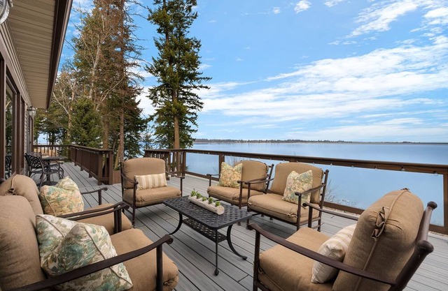 Waterfront home with private dock, beach, hot tub & wrap-around deck