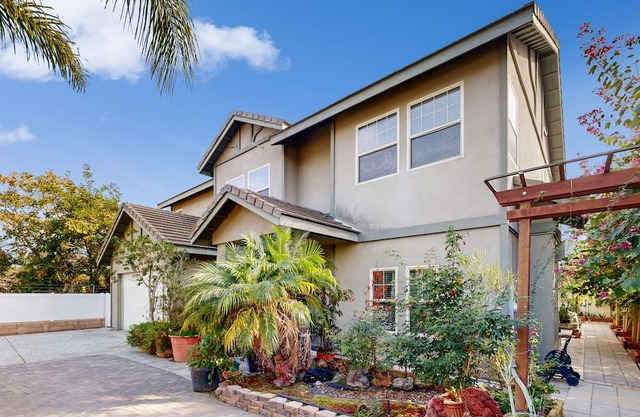 Centrally located home with private patio, updated interior, fireplaces, & W/D