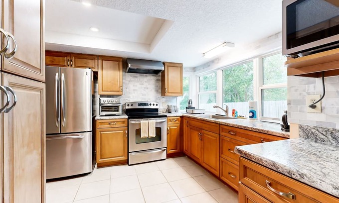 Arlington House | Charming retreat with a large patio, yard & central AC