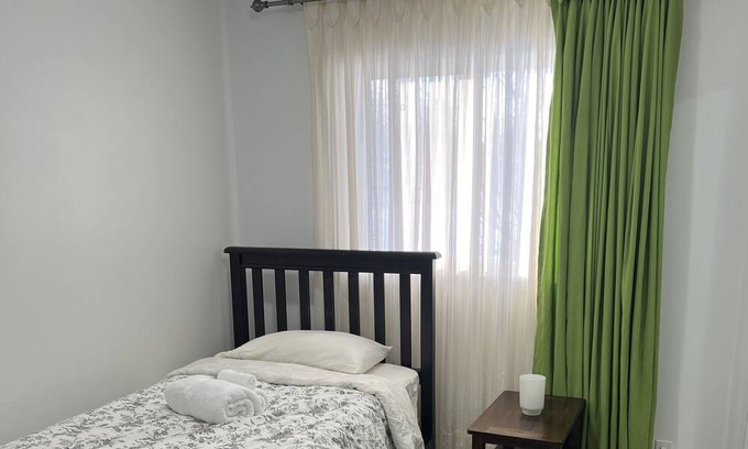 Brandon Apartment | Comfortable Stickney bedroom.