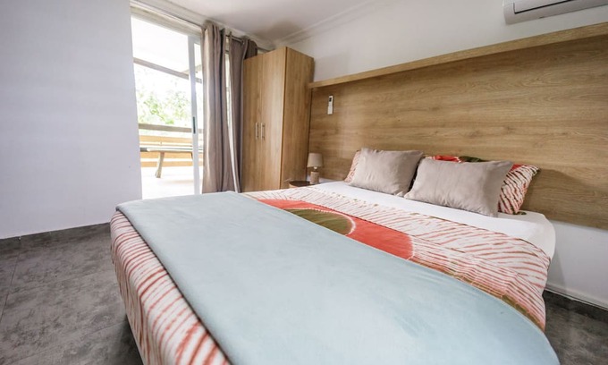 Aburi Bed & Breakfast | Rustic and unique private room with large wraparound balcony up in the Trees!