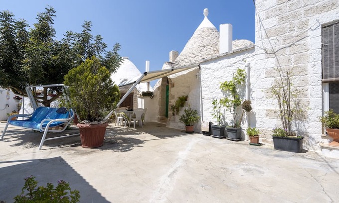 Casalini House | Holiday Home 'Trullo Antica Pietra' with Private Terrace, Private Garden and Air Conditioning