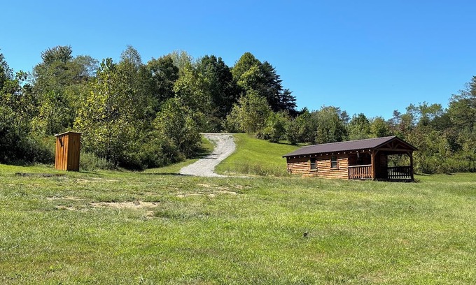 Kerr Apartment | Charming one-room cabin retreat with private bath, kitchenette and log gazebo.