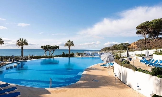 Oura Hotel | Group Getaway in Oura Beach! Four Sea View Units, Swimming Pools, Beachfront!
