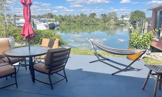 Isles of Capri Apartment | Peaceful Waterfront Efficiency~Dolphins, Manatees and Island Vibes