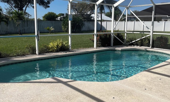 Port Saint Lucie House | Tropical Retreat 3 Bedroom 2 Bath Full House with saltwater pool & huge backyard